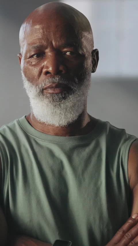 Strong, face and black man with arms crossed at gym for bodybuilding, sport Video stock 333707038