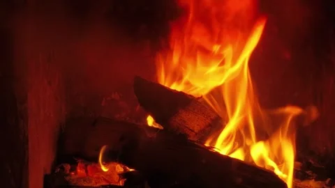 Strong fire consuming wooden logs in fireplace, Stock Footage 346037449