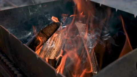A strong flame of fire in a black barbecue Stock Footage 158984673