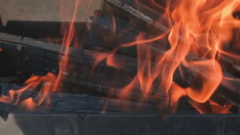 A strong flame of fire in a black barbecue Stock Footage 159403785