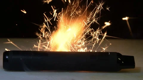 A strong flash covers the damaged body of the electronic cigarette, intense spar Video stock 323141700