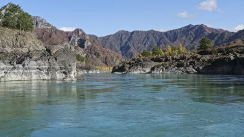 Strong flow of mountain river with rocky shores and winding curve riverbed Stock Footage 230877632
