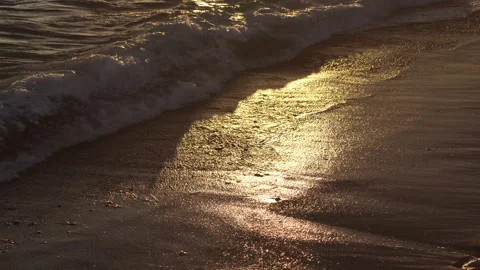Strong foamy waves at sunset on sea sandy beach in dark in Cadiz Spain. Stockbeeldmateriaal 237373655