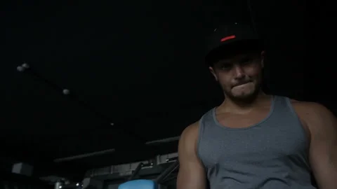 Strong guy is doing EZ barbell curl Video stock 85617570