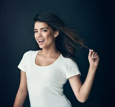 Strong hair makes you feel even stronger. Studio shot of a beautiful young woman Foto stock