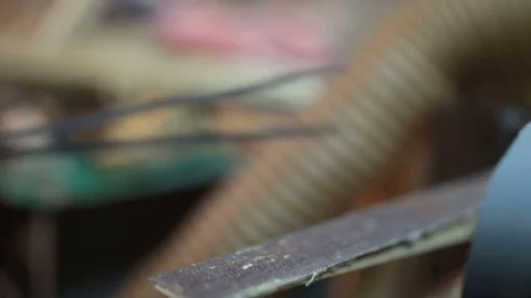 Strong hands grind a wooden plank for cue Stock Footage 76444553