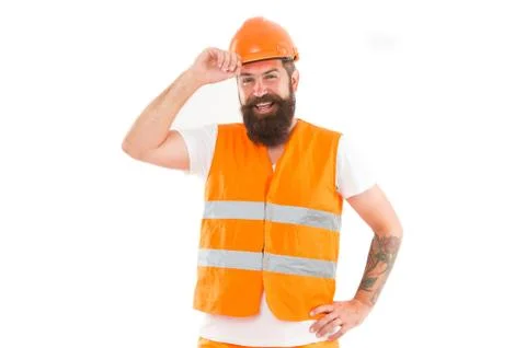 Strong handsome builder. Creating solid foundation. Man protective hard hat and 库存照片