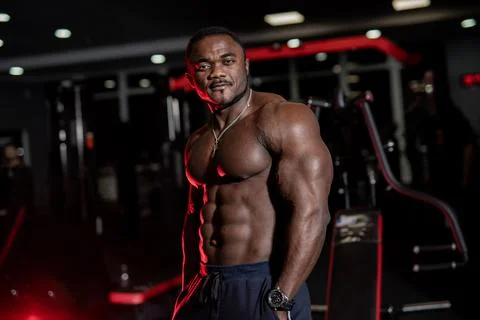 Strong healthcare bodybuilder posing for camera. Handsome young muscular man  Stock Photos