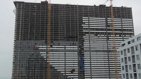 Strong hurricane throws down building materials from roof of unfinished house Stock Footage 118444904