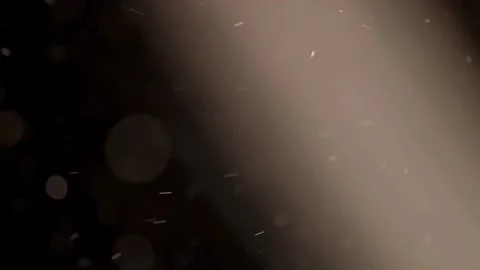 Strong light beam illuminates shimmering floating tiny dust particles Stock Footage 329598611