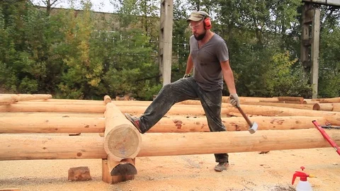 Strong lumberjack chopping wood Stock Footage 79980205