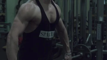 Strong man bodybuilder doing lateral fro... | Stock Video | Pond5
