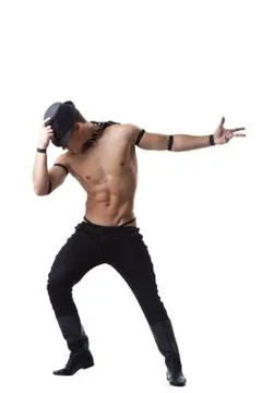 Strong man dance striptease in hat Stock Photos