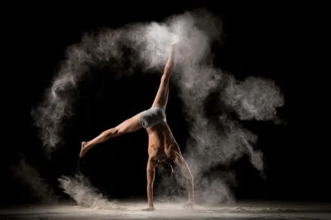 Strong man dancing in circle of sand Stock Photos