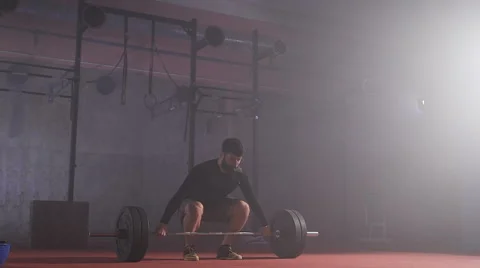 Strong man doing barbell snatch exercise at the gym in slow motion Stock Footage 68779816