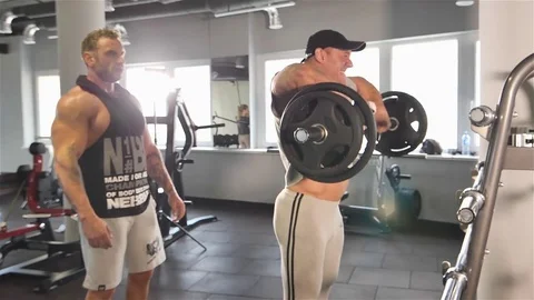 Strong man doing barbell snatch exercise at the gym in slow motion. Stock Footage 82416995