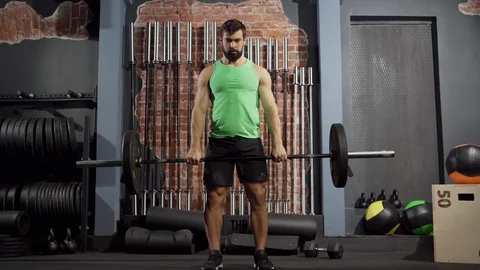 Strong man doing deadlift exercise with barbell Stock Footage 124833826