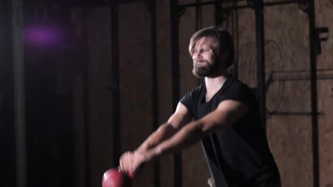Strong man Doing Exercises Lifting Kettlebell Fitness Center Crossfit. Video stock 142229911