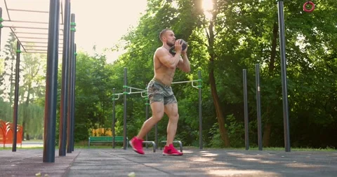 Strong man Doing Exercises Lifting Kettlebell Fitness. Muscular man exercising Stock Footage 157890184