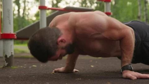 Strong Man Doing Push-ups Outdoors 스톡 동영상 330921409