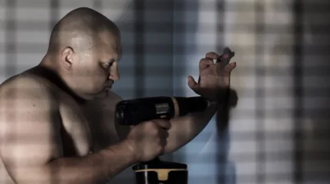 Strong man drilling a wall Stock Footage 8623427