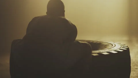 Strong man flipping tyre Stock Footage 236191708