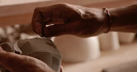 Strong man hands working with raw clay. Work close-up. Video stock 127394930