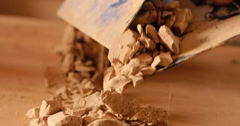 Strong man hands working with raw clay. Work close-up. Video stock 127395285