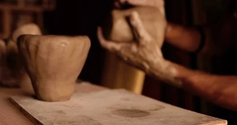 Strong man hands working with raw clay. Work close-up. Video stock 127413862
