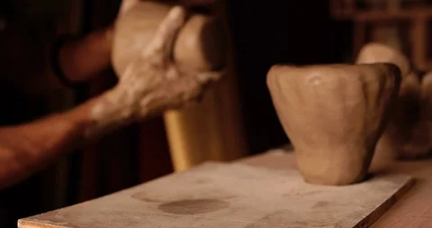 Strong man hands working with raw clay. Work close-up. Video stock 127414525