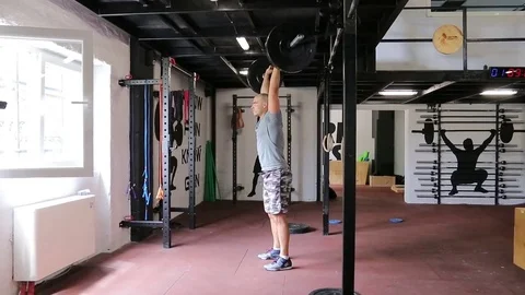 Strong man is holding weights Stock Footage 83513718