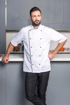 Strong man in the kitchen Stock Photos
