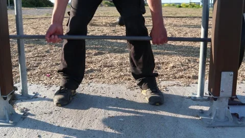 Strong man lifting bar. Stock Footage 247738437