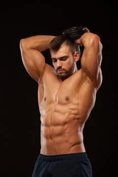 Strong man making exercises on triceps with a dumbbell. Close up shot training Stock Photos