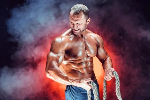 Strong man with rope Stock Photos
