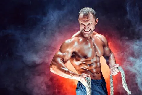 Strong man with rope Stock Photos