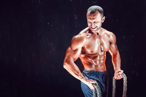 Strong man with rope Stock Photos