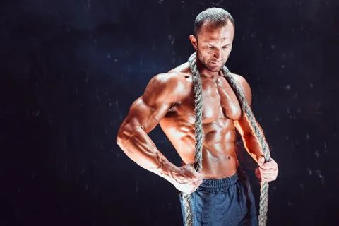 Strong man with rope Stock Photos