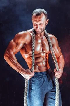 Strong man with rope Stock Photos