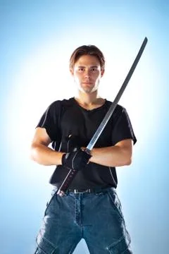 Strong man with samurai sword Stock Photos