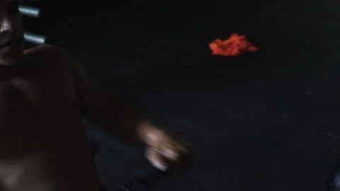 Strong man showcasing strength while pulling heavy weight on gym machine Stock Footage 312717068