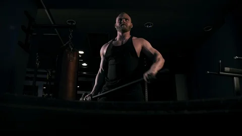 Strong man in training with a hammer and wheel Video stock 88930977