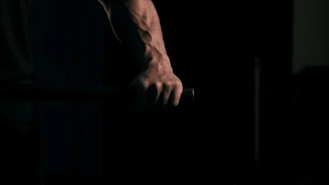 Strong man in training with a hammer and wheel Stock Footage 89604498