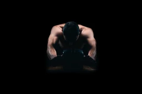 Strong man using an abs roller Stock Photos