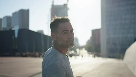 Strong mature man warming up doing sprints ready to go for a run. Middle aged Stock Footage 273725178