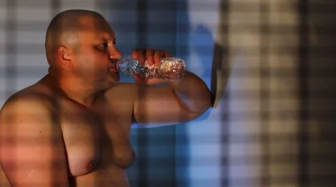 Strong men drinking fresh water Stock Footage 8623349