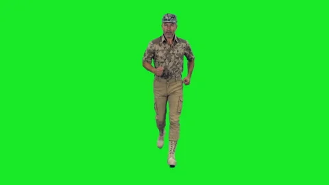 Strong mid-aged man officer in military khaki uniform running on green screen Stock Footage 304992559