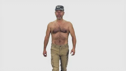 Strong middle aged man walking shirtless in military hat, alpha in Stock Footage 305793422