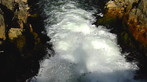 Strong mountain river passing over rocks. Видео 226415980
