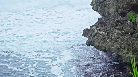 Strong Ocean Waves Crashing Against Sharp Coral Rocks Stock Footage 296569845